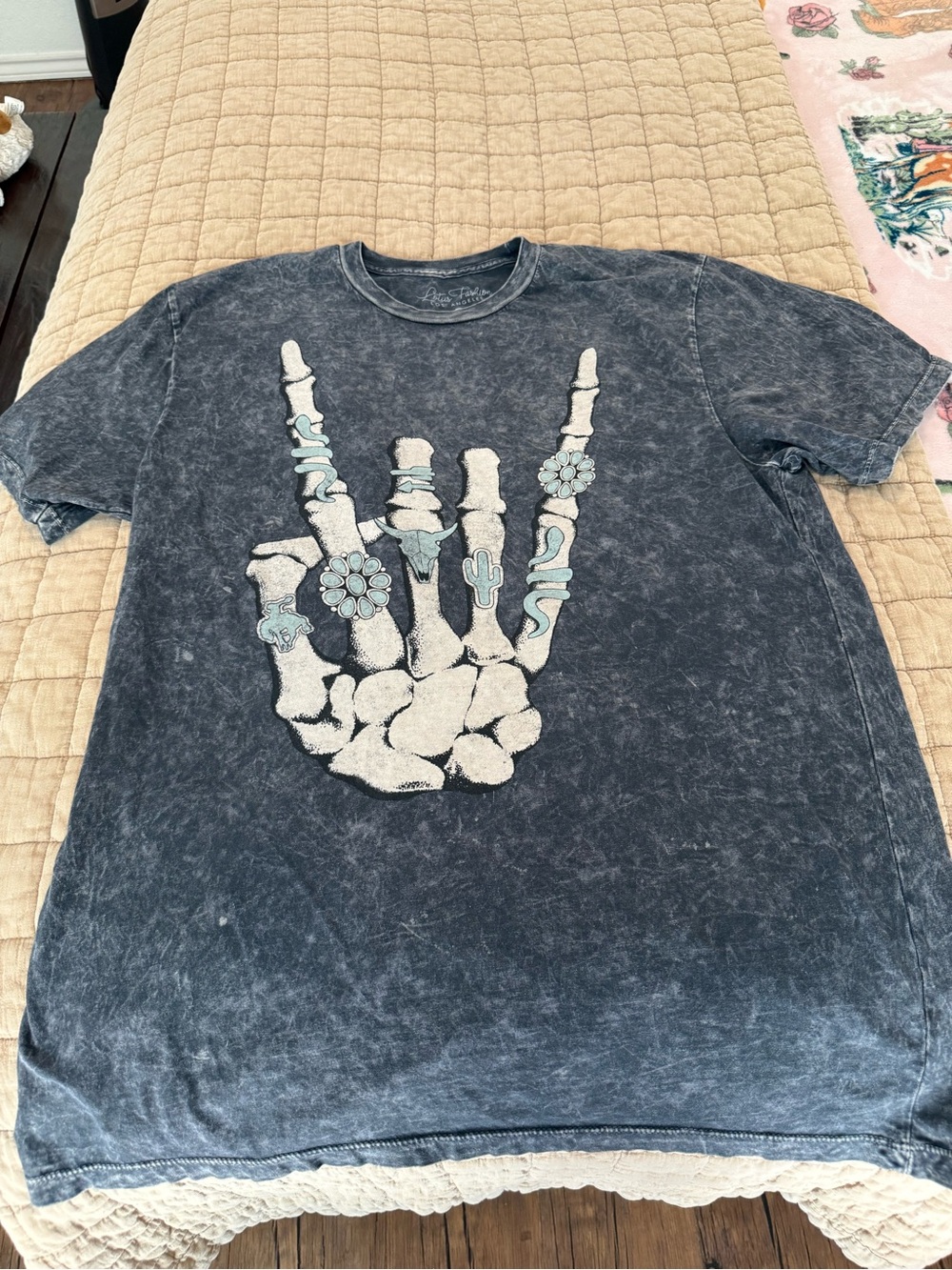 Lotus Fashion Skeleton Hand Graphic Tee in Distressed Black